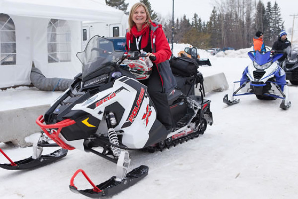 people on a snowmobile
